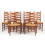 Property of a lady - a set of six reproduction rush seated ladder-back chairs including two