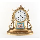 Property of a gentleman - a late 19th century French porcelain mounted ormolu cased mantel clock,