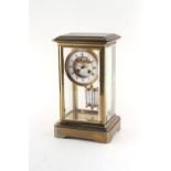 Property of a deceased estate - a late 19th century French brass four glass mantel clock, the