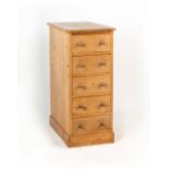 Property of a gentleman - a pine narrow chest of five drawers with turned handles, 17.5ins. (44.