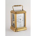 A 19th century French brass gorge cased alarm repeating carriage clock, the enamel dial inscribed '