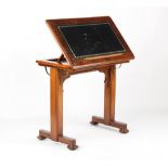 Property of a deceased estate - a Victorian walnut adjustable reading & writing table, with