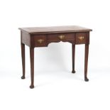 A mahogany & oak lowboy with three drawers, on club legs & pad feet, 34.75ins. (88cms.) wide (