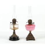 Property of a lady - a Victorian paraffin oil lamp with moulded pink glass reservoir; together