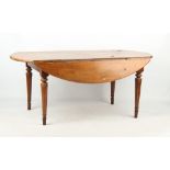 Property of a gentleman - a large French chestnut oval drop-leaf kitchen table, late 19th century,