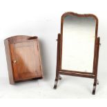 Property of a gentleman - a walnut swing-frame toilet mirror; together with a small mahogany wall