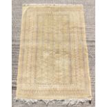 Property of a gentleman - a finely knotted Turkoman design rug with pale yellow ground, 74 by 51ins.