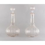 Property of a lady - a pair of late 18th / early 19th century glass decanters with blown stoppers,