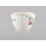 Property of a gentleman - a Chelsea fluted tea bowl, circa 1760, painted with scattered flowers & an