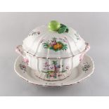 Property of a gentleman - a large French faience tureen & cover on stand, 19th century, painted with