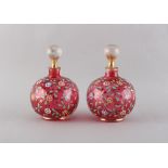 Property of a deceased estate - a pair of late 19th century enamel floral decorated cranberry