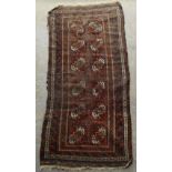 Property of a gentleman - an early 20th century Belouch rug with kelim ends, worn, 88 by 41ins. (224