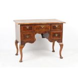 Property of a gentleman - a walnut & featherbanded lowboy, parts 18th century, 39.25ins. (99.