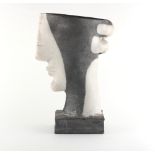 Property of a lady - studio pottery - a slab built raku vase modelled as a head, incised initials KK