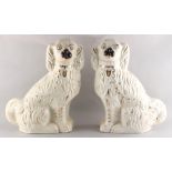 Property of a deceased estate - a large pair of Victorian Staffordshire models of seated spaniels,
