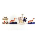 Property of a lady - two Victorian Staffordshire inkwells modelled as recumbent greyhounds; together