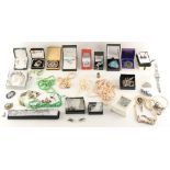Property of a lady - a box containing assorted costume jewellery including a pearl single strand
