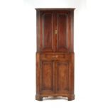 Property of a lady - a composite George III oak two-part corner cabinet, 81.5ins. (207cms.) high.