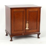 Property of a lady - a mahogany panelled two-door cabinet, with short cabriole legs, 29ins. (73.