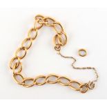 Property of a lady - an unmarked yellow gold (tests 18ct) chain link bracelet, with one loose