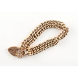 Property of a deceased estate - a 9ct gold curb link bracelet with heart clasp, approximately 15.9