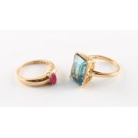 Property of a deceased estate - an 18ct yellow gold dress ring set with a blue stone; together