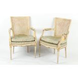 Property of a lady - a pair of early 20th century French Louis XVI style painted & cane panelled
