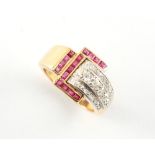 A modern yellow gold ruby & diamond ring, of buckle form, the estimated total diamond weight 1.10