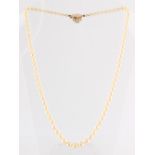 Property of a deceased estate - a graduated single strand pearl necklace, with tiger's eye clasp,