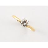 An 18ct yellow gold diamond single stone ring, the round brilliant cut diamond weighing