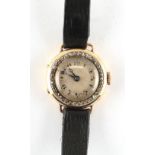 Property of a deceased estate - a lady's 18ct yellow gold wristwatch with diamond set bezel,