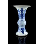 A Chinese blue & white gu vase, 19th century, with a band of scrolling lotus flanked by bands of