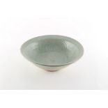 Property of a lady - a Chinese celadon glazed dish, 14th/15th century, with lightly incised