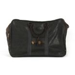 Property of a lady - a Mulberry black leather holdall or soft case, 72cms. long.