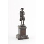 Property of a lady - a 19th century patinated bronze figure of Napoleon, 5.9ns. (15cms.) high.