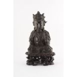 A Chinese bronze model of a seated Buddha, Ming Dynasty (1368-1644), with traces of gilt to reverse,