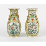 Property of a lady - a pair of late 19th century Chinese Canton famille rose baluster vases with