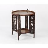 Property of a deceased estate - a Chinese carved hongmu circular two-tier folding table, late 19th /