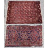 Property of a lady - a Turkoman rug with four rows of octagonal guls, 55 by 43ins. (140 by 109cms.);