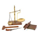 Property of a gentleman - a set of Victorian brass balance scales on oak base, 23ins. (58.5cms.)
