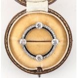 A good early 20th century Art Deco diamond & sapphire hoop brooch, set with four Old European cut