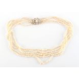 A fine natural pearl five strand necklace, with unmarked yellow gold navette shaped clasp set with