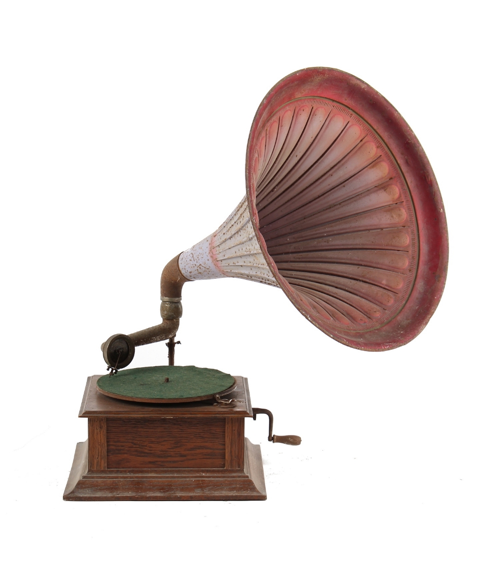 Property of a deceased estate - an early 20th century oak cased wind-up gramophone with tin horn.