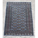 Property of a gentleman - a Tekke design hand knotted rug with pale blue ground, 72 by 51ins. (183