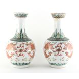 Property of a lady - a pair of late 19th century Chinese dragon vases, underglaze blue apocryphal