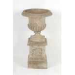 Property of a deceased estate - a reconstituted stone garden urn on plinth base, 31ins. (79cms.)