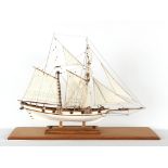 Property of a gentleman - a modern wooden scale model sailing ship, in glass case, the case