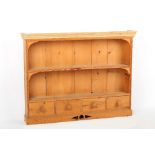 Property of a gentleman - a pine freestanding table top plate rack with spice drawers under,