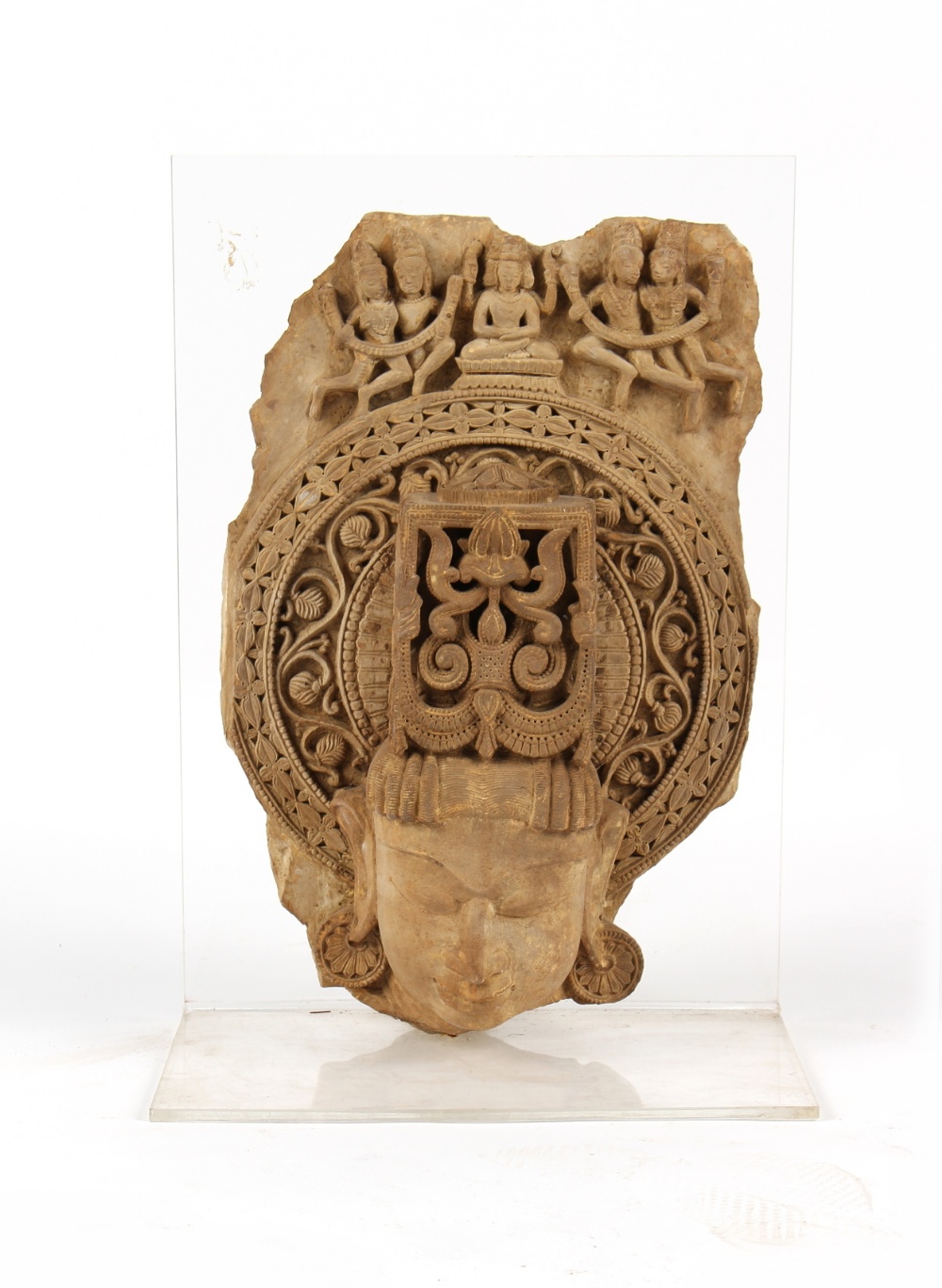 Property of a gentleman - an Indian carved sandstone fragment, on perspex stand, 26.5ins. (67.5cms.)