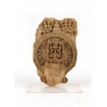 Property of a gentleman - an Indian carved sandstone fragment, on perspex stand, 26.5ins. (67.5cms.)